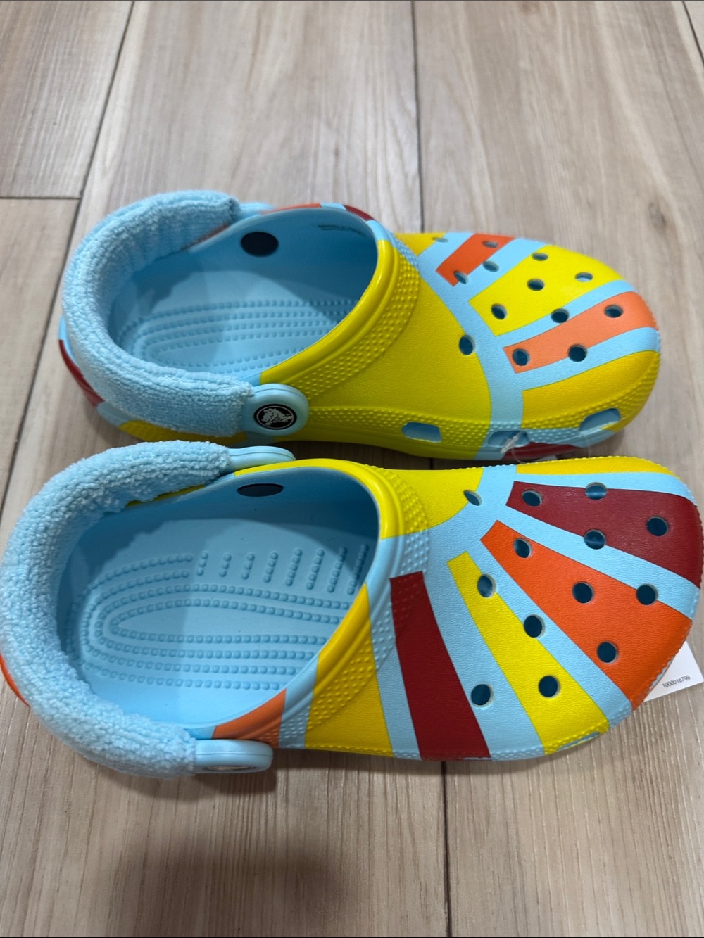 CROCS Kids Yellow, Light Blue, Red & Orange Patterned Clogs
